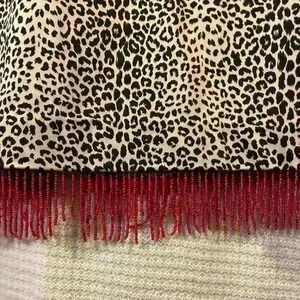 Bliss pencil skirt in animal print with red trim.